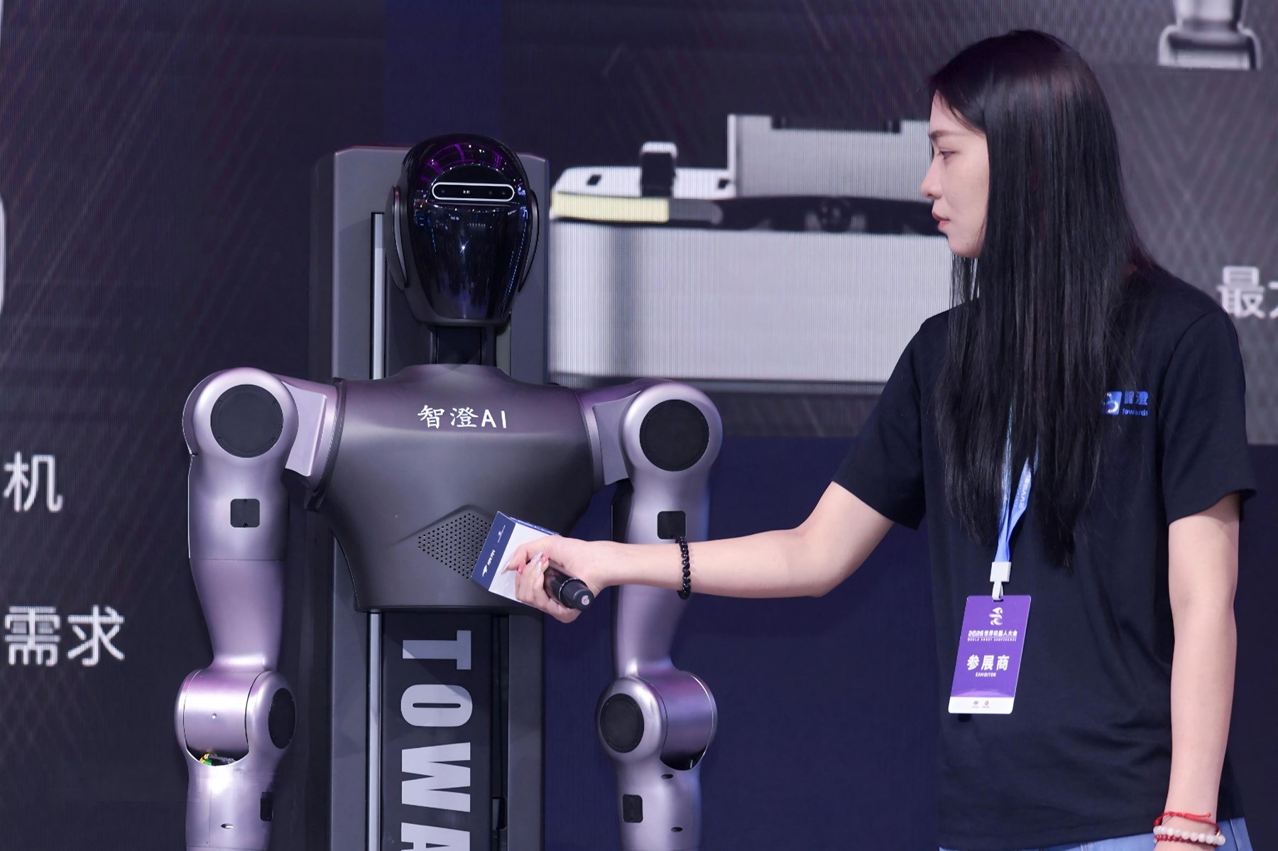 XR1 handing an item to a visitor at a trade show